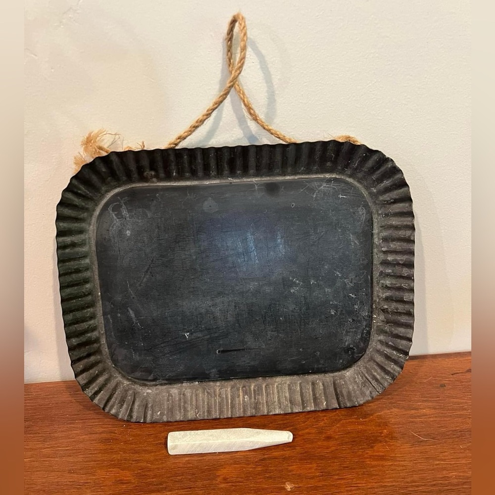 Small rectangular chalkboard with fluted metal edge.